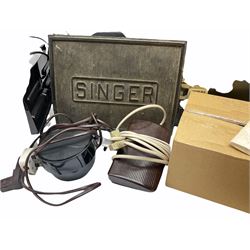Two Singer sewing machines, model numbers 527 and 457, together with various Singer sewing machine parts, and a selection of sewing related accessories, to include threads, sewing needles, etc. 