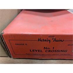 Hornby 'O' gauge 42380 No.2 Turntable, 43063 Points and 42320 No. 1 Level Crossing, all boxed, together with two tin plate passenger coaches, Hornby 'O' gauge LMS tender, three plastic 'O' gauge wagons, Hornby mechanisms, HM Duette Transformer Controller and other accessories