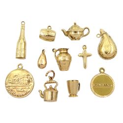  Seven 9ct gold pendant / charms including kettle, bottle, barrel and teapot, 17ct gold flask charm, 18ct gold 'Benidorm' charm and two 14ct gold charms 