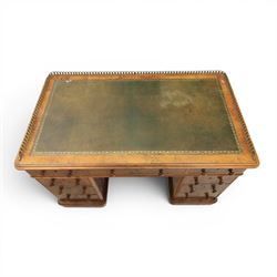 Victorian figured walnut twin pedestal desk, brass galleried top with inset tooled green leather writing surface, above three frieze drawers, raised on two pedestals with three drawers, on plinth bases above castors