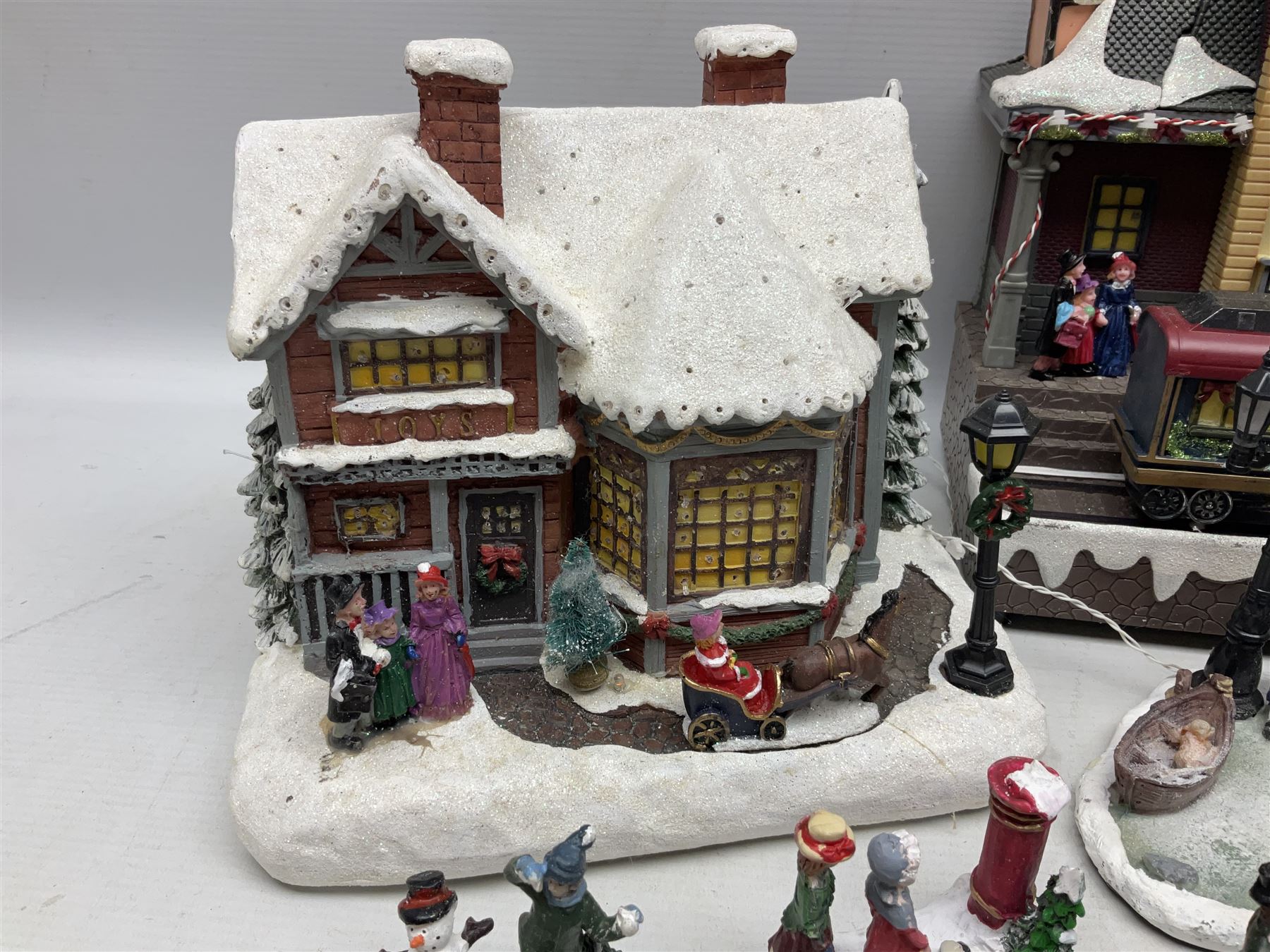 Christmas decorations; Premier LED Christmas Village scene with moving train, together with three Lumineo christmas scenes, and other similar 