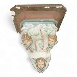Set of three Belgian wall cornices, each with moulded shelf top above polychrome painted cherubic and rococo scroll ornament

Pale green (H 43cm, D 42cm, W 39cm)
Painted cherubs (H 51cm, D 47cm, W 49cm)
Darker green (H 46cm, D 42cm, W 50cm)