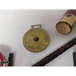 Walking stick with carved monkey handle, glass shooting flask in the form of a cartridge, bullet casings and other collectables