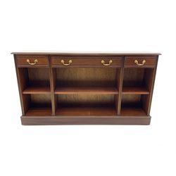 Sydney Smith - mahogany sideboard, cross banded and inlaid detail, three short drawers above three adjustable shelves, raised on platform base