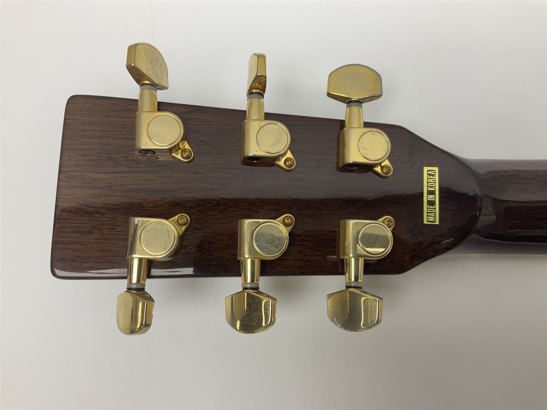 Ozark metal cased resonator guitar with all over chased foliate decoration to the polished finish and mother-of-pearl inlay to the fretboard L100cm; in Stagg hard carrying case