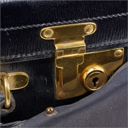 Early 20th century ladies leather travelling dressing case marked Walker & Hall, with watered silk interior and contents of silver mounted glass jars, dressing table set, leather blotter etc and with outer canvas London 1921/22 Maker Thomas Ingleton 46cm x 31cm 