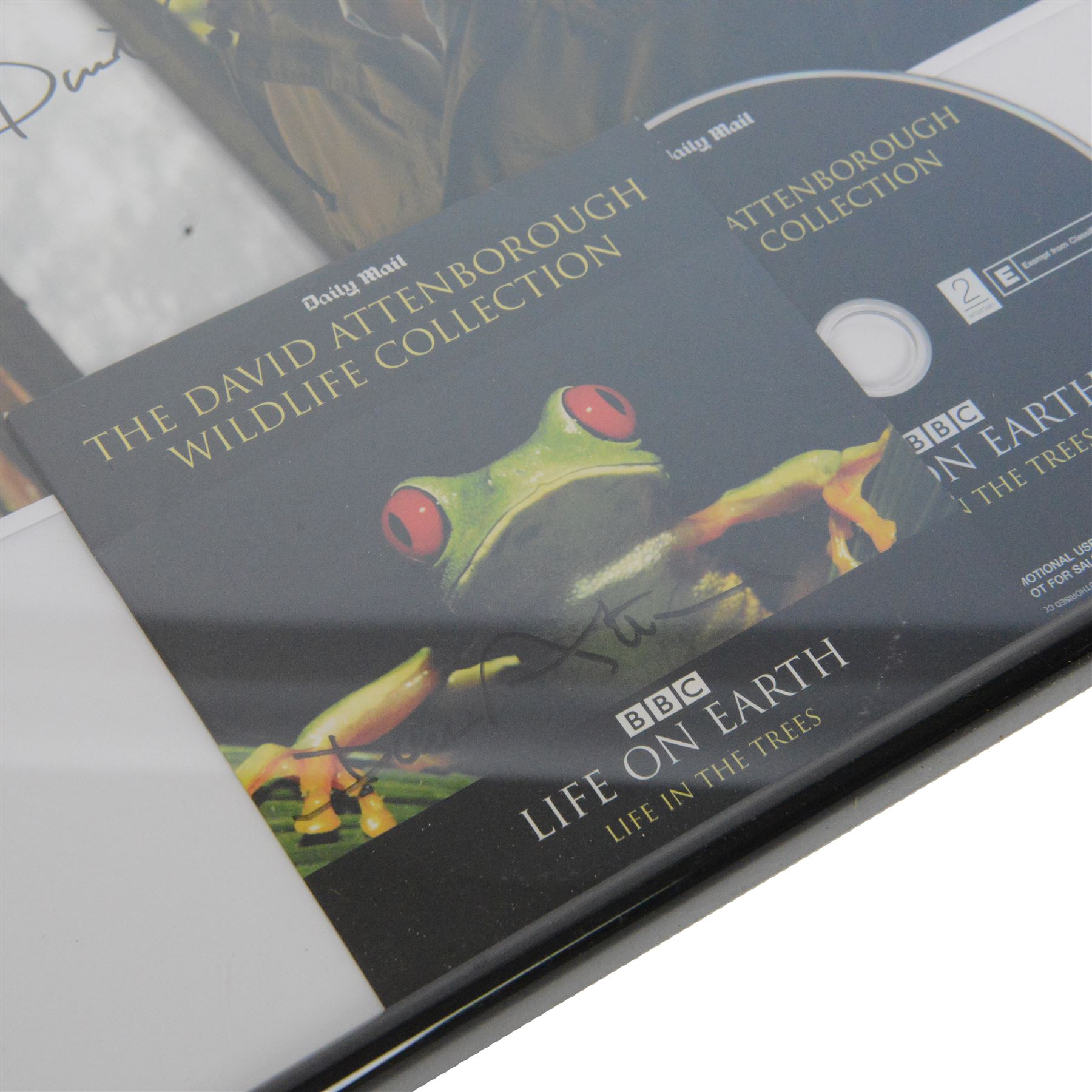 Signed David Attenborough photograph and a signed David Attenborough Life on Earth DVD sleeve, framed H32cm
