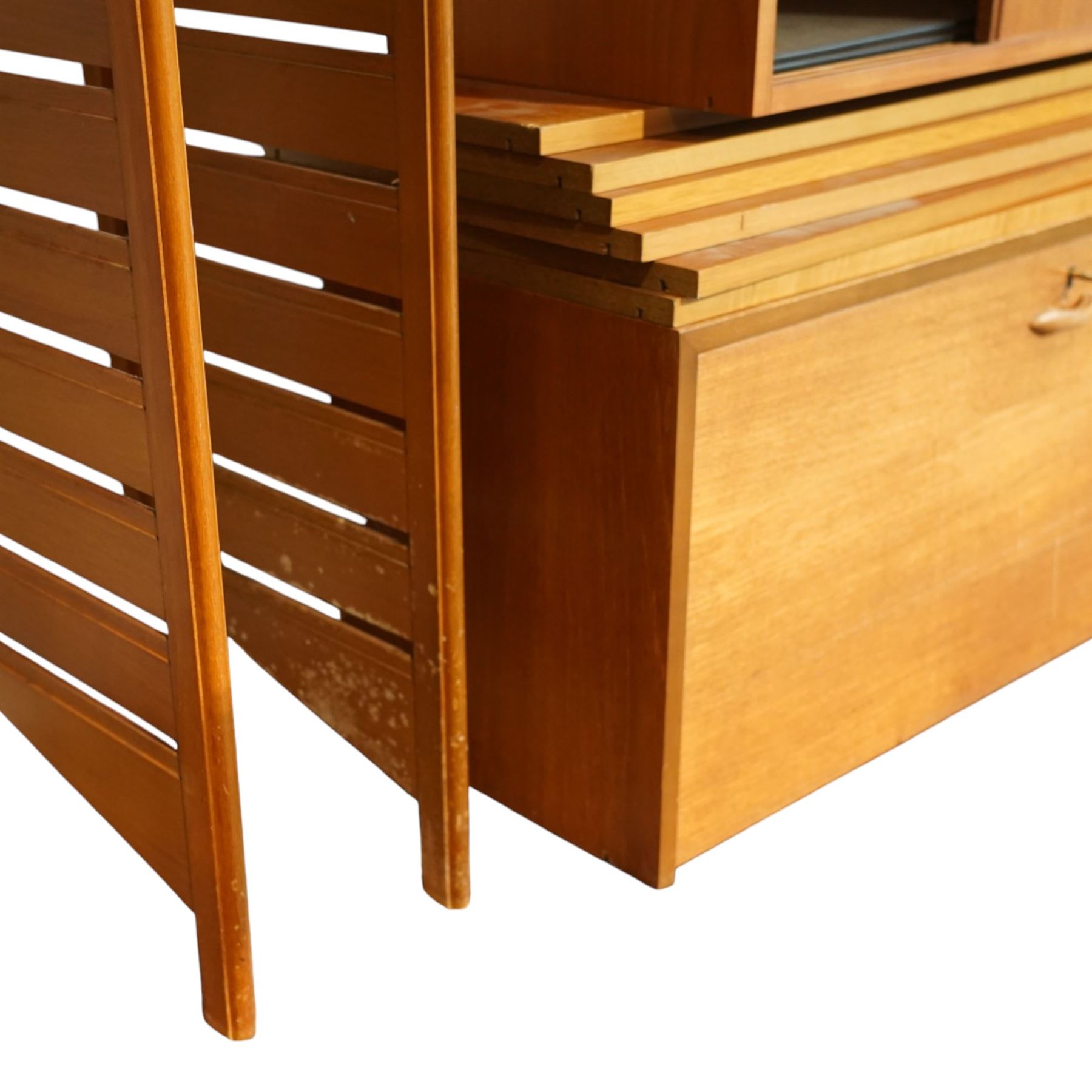 Ladderax - mid 20th century teak modular wall unit, comprising two sliding door cabinets, one fall-front cabinet, six shelves, four ladder supports and fourteen metal cross braces