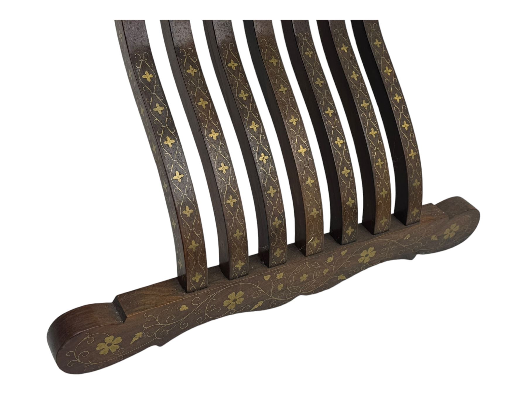 Late 20th century brass inlaid hardwood throne chair, curved X-frame form, raised shaped back inlaid with trailing leafy branches and flower heads, on sledge feet 