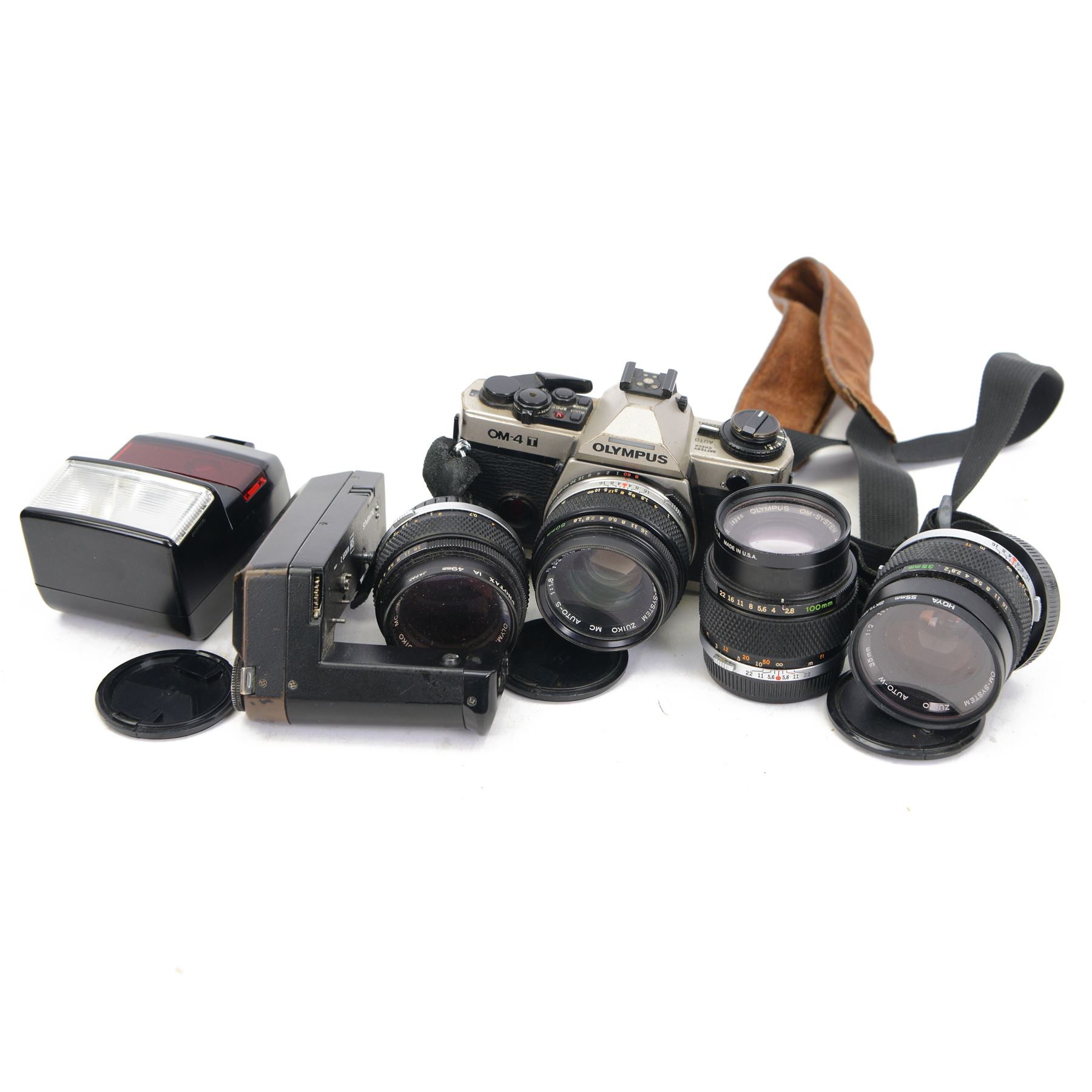 Olympus OM-4 T camera body serial no. 1126911, with two Olympus OM-System Zuiko MC Auto-S lenses, one 1:1.54 f=50mm, the other 1:1.8 f=50mm, an Auto-W 35mm 1:2 lens, Olympus OM winder 2, flash and other accessories, in a Tamrac carry case 