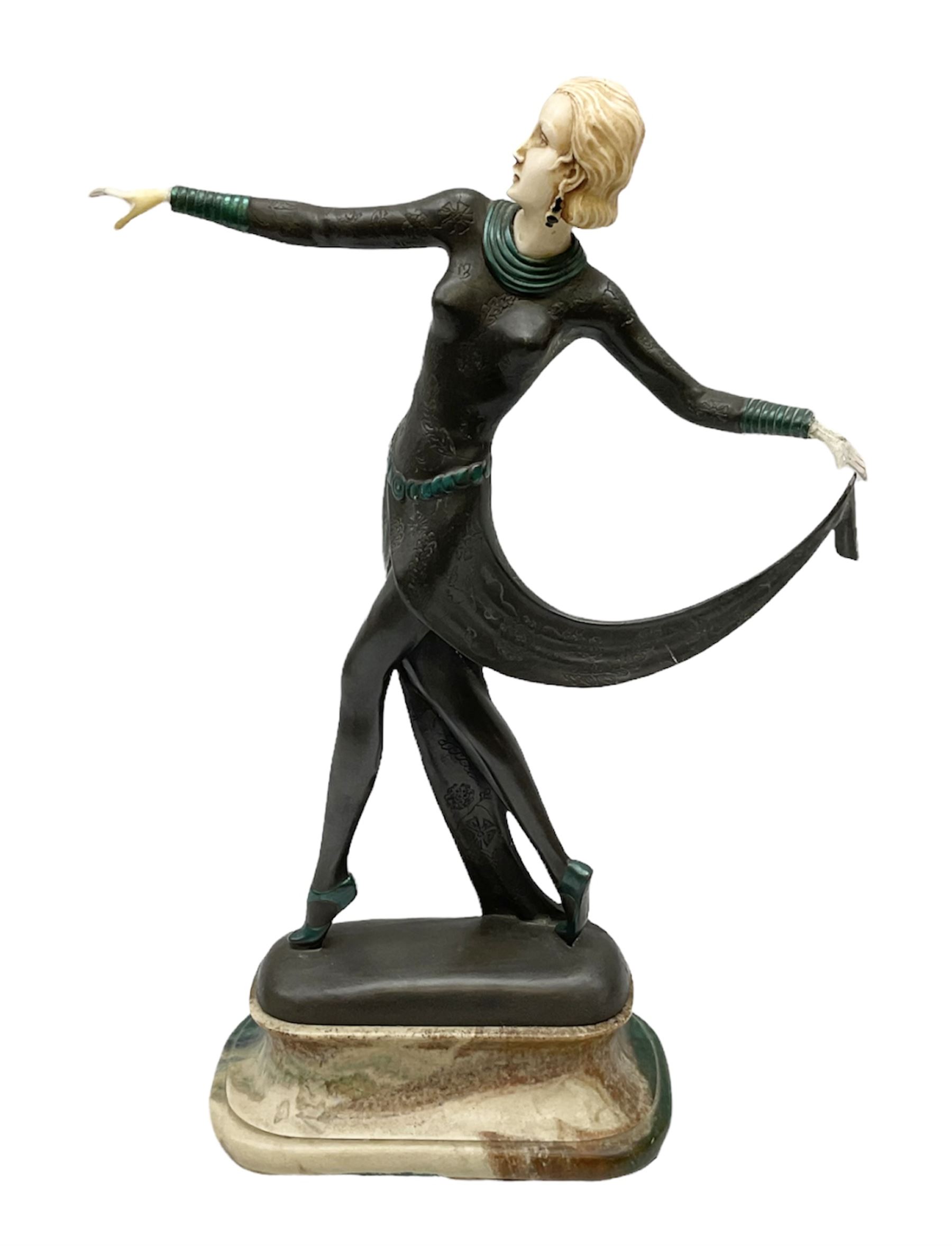 Art Deco style bronze, after Josef Lorenzl, modelled as a dancing lady with outstretched arms, with resin head and hands, raised upon marble effect base, signed to base, H38cm