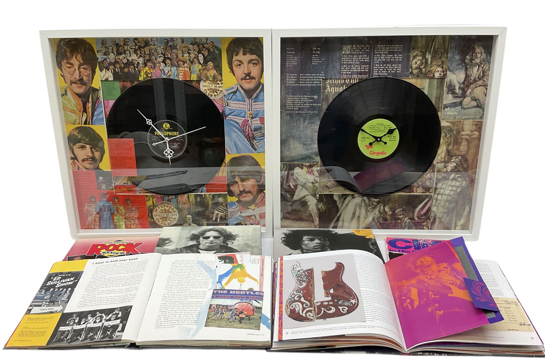 Two novelty framed LP wall clocks; two books containing replica memorabilia and CDs on John Lennon and Jimi Hendrix; Rock Review booklet; and book on Cliff Richard entitled 'Cliff In His Own Words' (6)