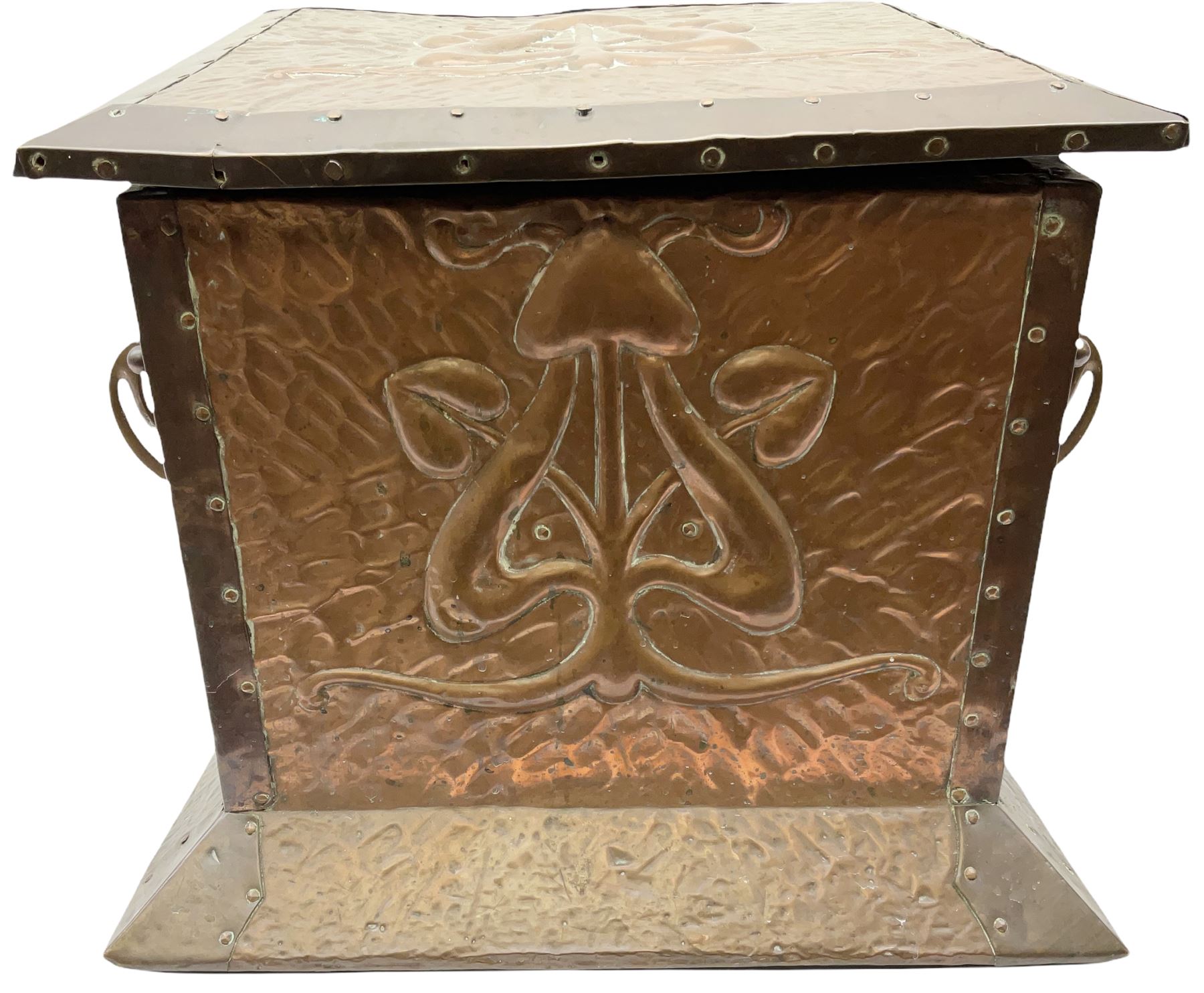 Arts and Crafts copper coal box, of square form with twin curved handles, with hammered finish, and embossed stylised motif to the front and hinged cover, H37cm L40cm D35.5cm