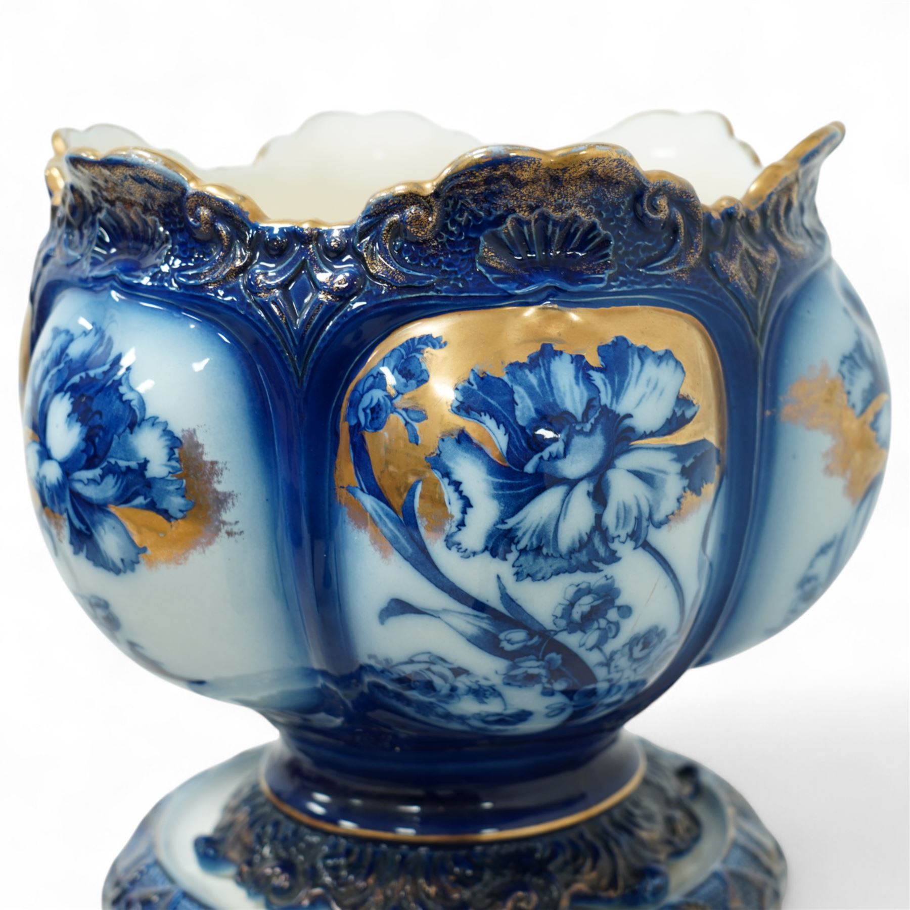 Staffordshire pottery jardiniere, decorated with flowers in blue and heightened in gilt, overall H46cm 