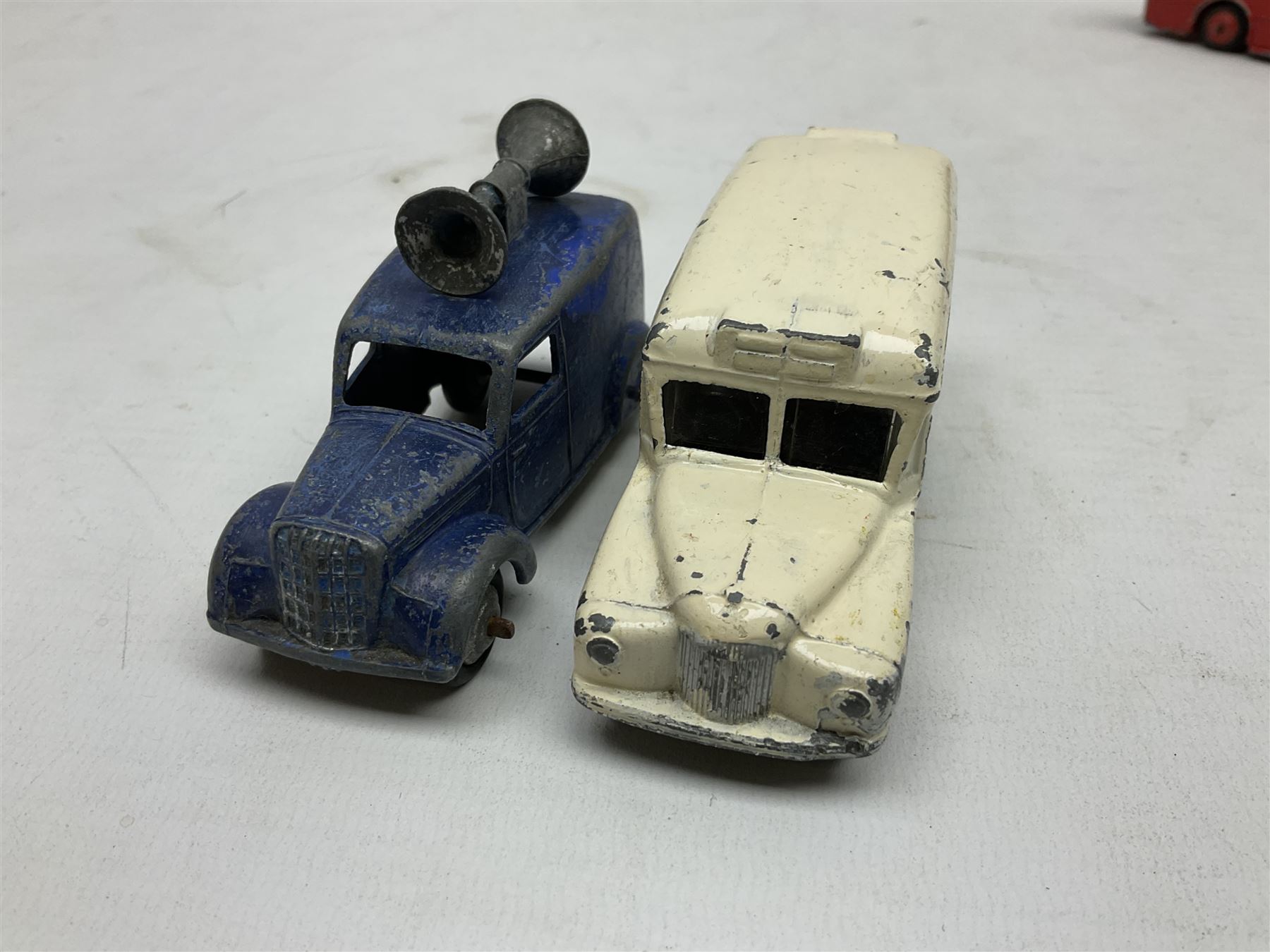 Dinky - Bedford 10cwt Van 'Kodak' No.480, boxed; and six unboxed and playworn models including Trojan Chivers Jellies van, loudspeaker van, Daimler Ambulance, N.C.B. Electric Van and two buses (7)