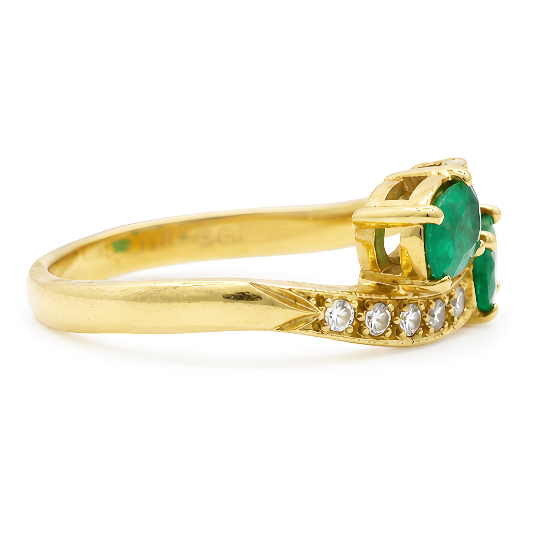18ct gold emerald and diamond crossover ring, set with five round brilliant cut diamonds and two oval cut emerald finials, Sheffield 1989, total emerald weight approx 0.40 carat