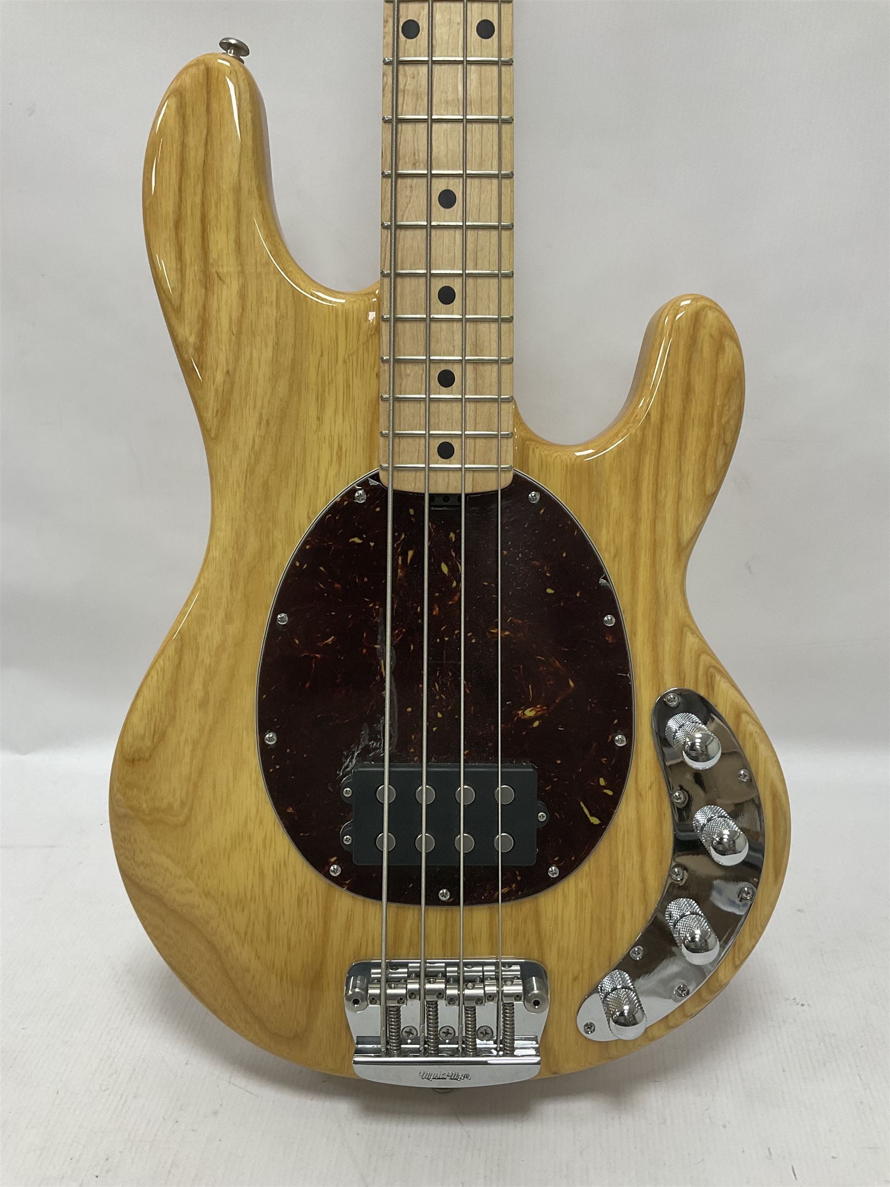 Ernie Ball Music Man Sting Ray 4 string bass guitar, in natural finish with roasted maple neck and tortoiseshell effect scratch guard, serial no 87485, in black Music Man hard case, guitar L114cm