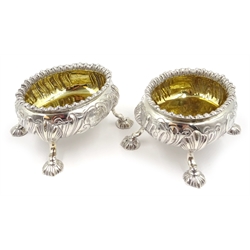  Pair of early Victorian silver salts, gadrooned borders, embossed scroll decoration, gilt interiors, contemporary crests by William Cooper, London 1852, diameter 9cm approx 9.5oz  