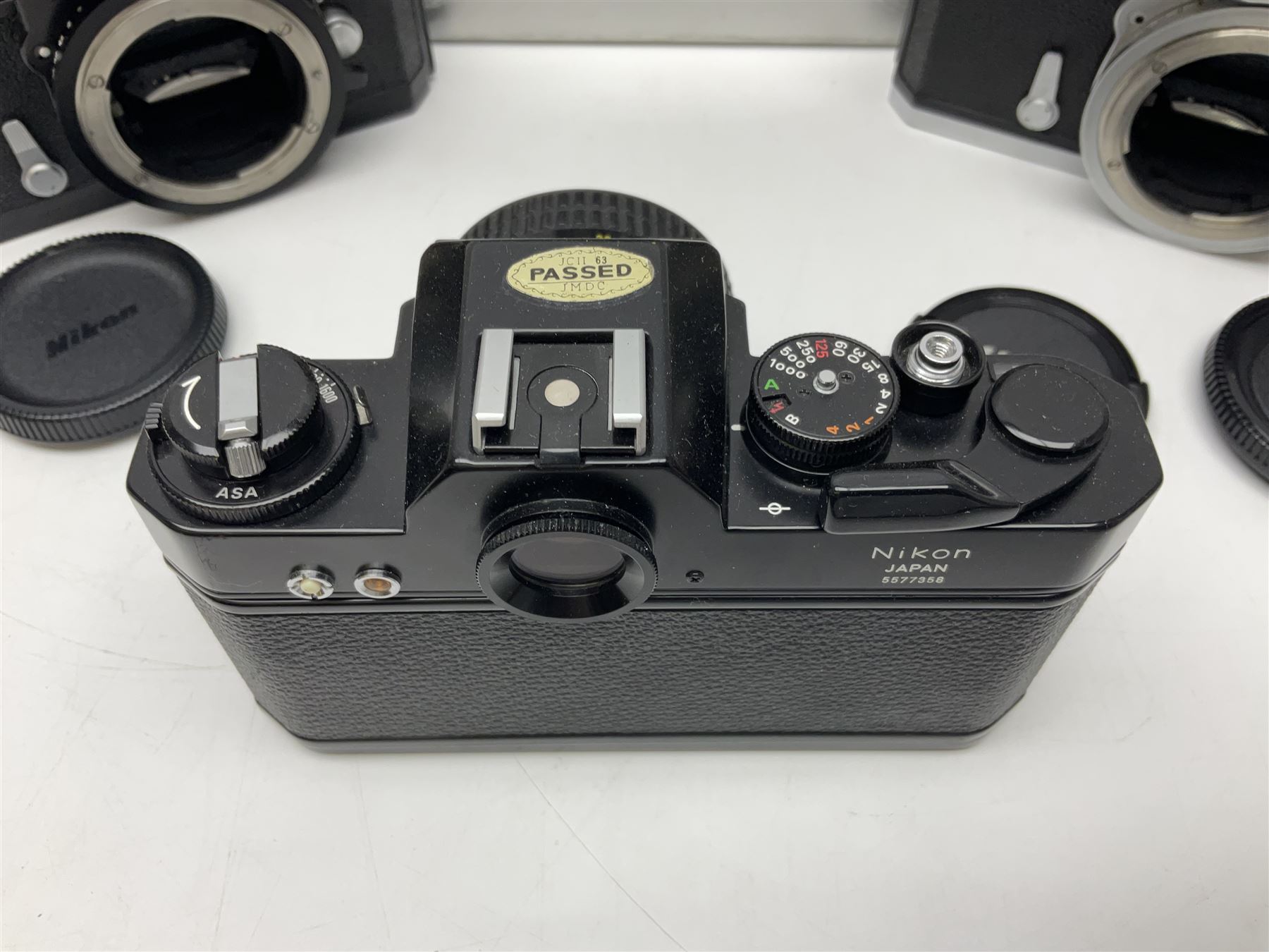 Nikkormat FT2 camera body, serial no. 5066813, in original packaging, together with Nikkormat EL camera body, serial no. 5577358, with Nikon Nikkor 50mm 1:1.8' lens no. 2143575, Nikkormat FT, serial no. 3968385, and Nikomat FT camera body, serial no. 4015491