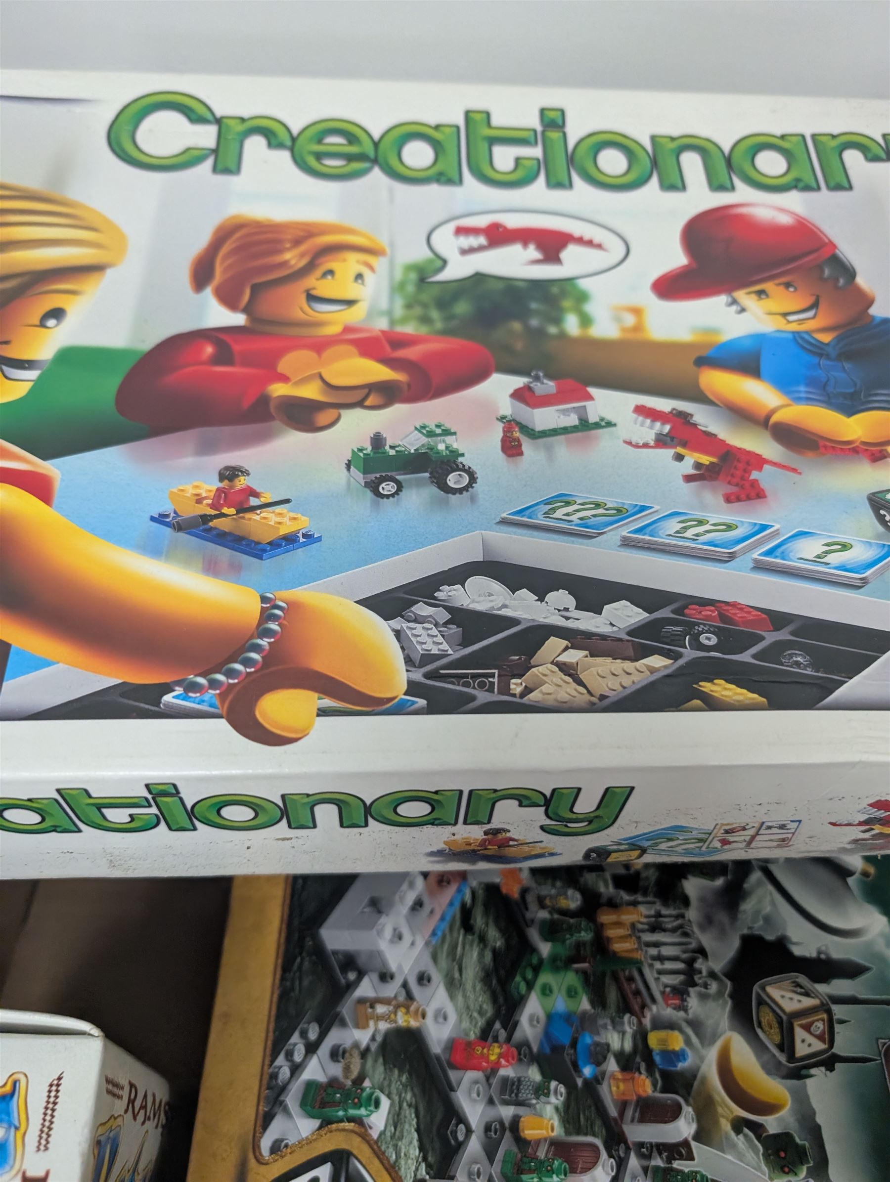 Collection of Lego Games sets, including no. 3841 Minotaurus, 3862 Harry Potter Hogwarts, 50011 Lord of the Rings Battle of Helms Deep, 3860 Heroica Fortaan, 3848 Pirate Plank, 3855 Ramses Return, 3844 Creationary, etc