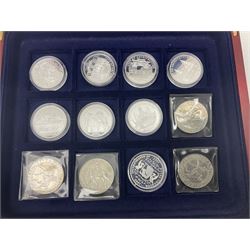 Eight sterling silver hallmarked 'Incorporated by Royal Charter' commemorative medallions, two Queen Elizabeth II 2000 five pound coins, commemorative crowns etc, housed in a coin display box