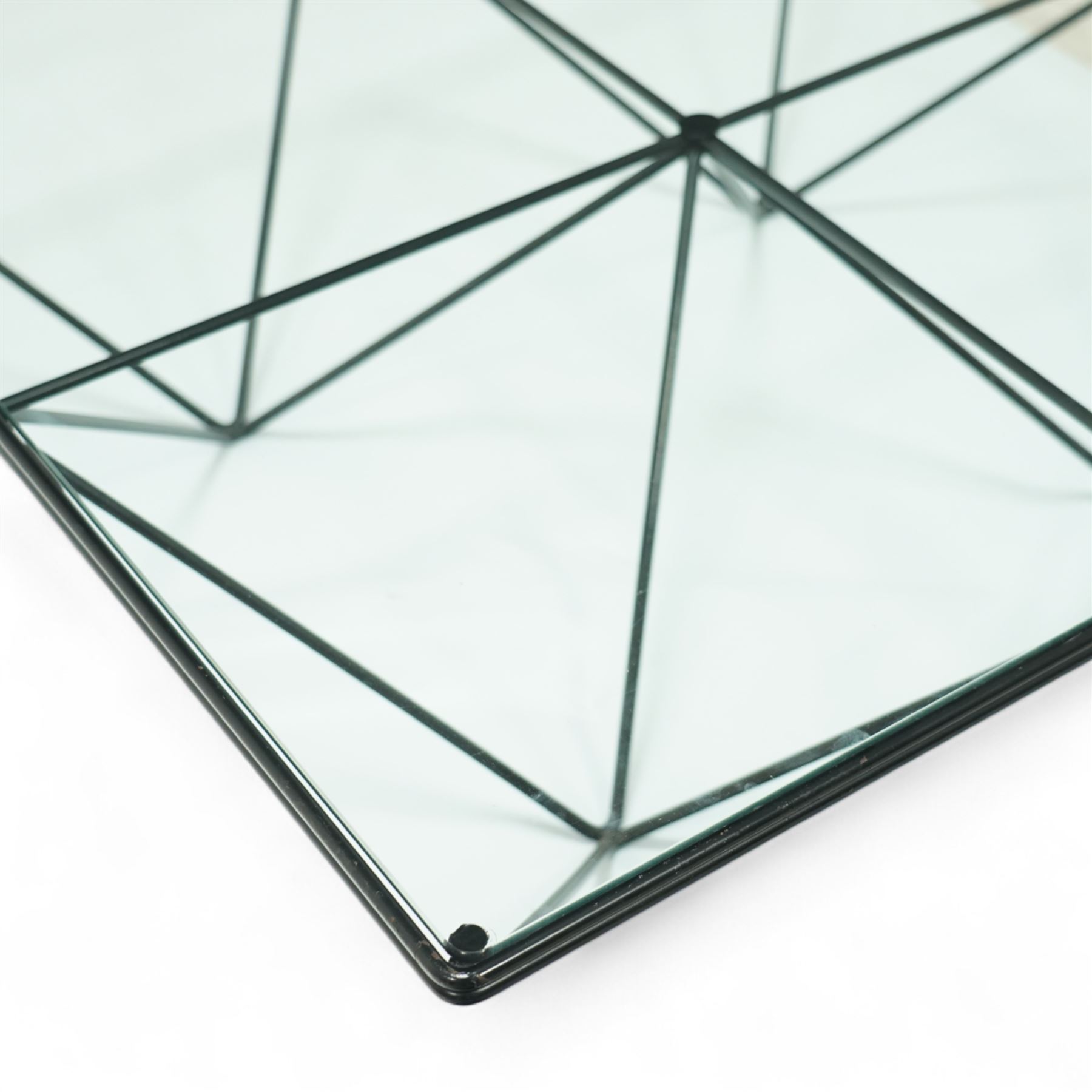 Paolo Piva for B & B Italia - Alanda coffee table with black powder-coated metal frame and clear glass top, the base with angular intersecting support struts forming a symmetrical design