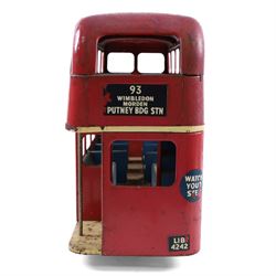 Tri-ang pressed steel pull-along London Transport Routemaster Double-Decker Bus, LIB4242, Route no.93 with destinations Wimbledon, Morden and Putney BDG Station, with red London Transport livery, blue interior, with pull cord and bell, H32cm, L57cm