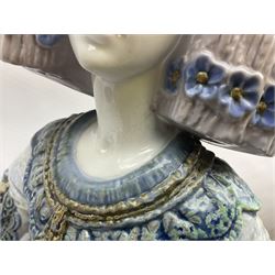 Large Lladro figure, La Menina, modelled as a maid of honor in service, on a mahogany oval base, limited edition 99/1000, sculpted by Jose Puche, with certificate of authenticity, framed and glazed, no 1812, year issued 1996, year retired 2019, H60cm