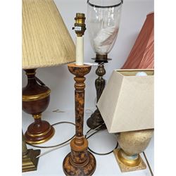 Pair of metal table candlesticks, with bell shaped glass shades, oil lamp with marble stem and cut glass reservoir, together with three ceramic table lamps, tallest H66cm