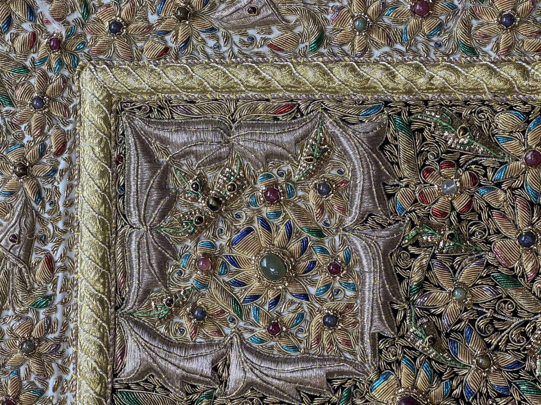 20th century large Zardozi wall hanging, hand embroidered in gold thread on black velvet ground with semi-precious stones and central medallion  149x93cm