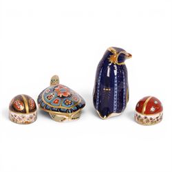 Four Royal Crown Derby paperweights, comprising Terrapin gold stopper, Rockhopper penguin gold stopper, Ladybird gold stopper and Beatle silver stopper