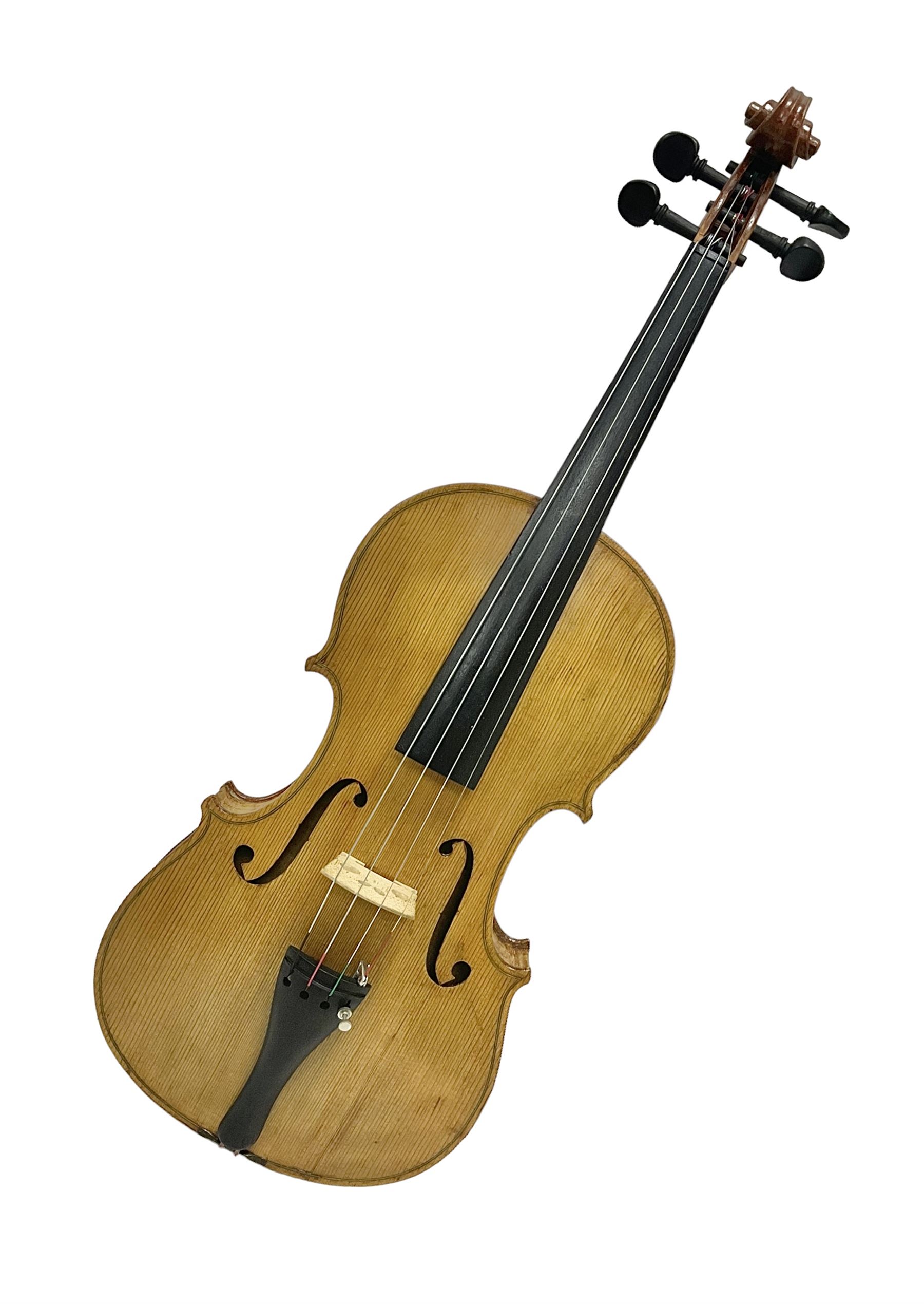 Copy of a full size Stradivarius violin, with an ebonised fingerboard, tailpiece and tuning pegs Length 60cm