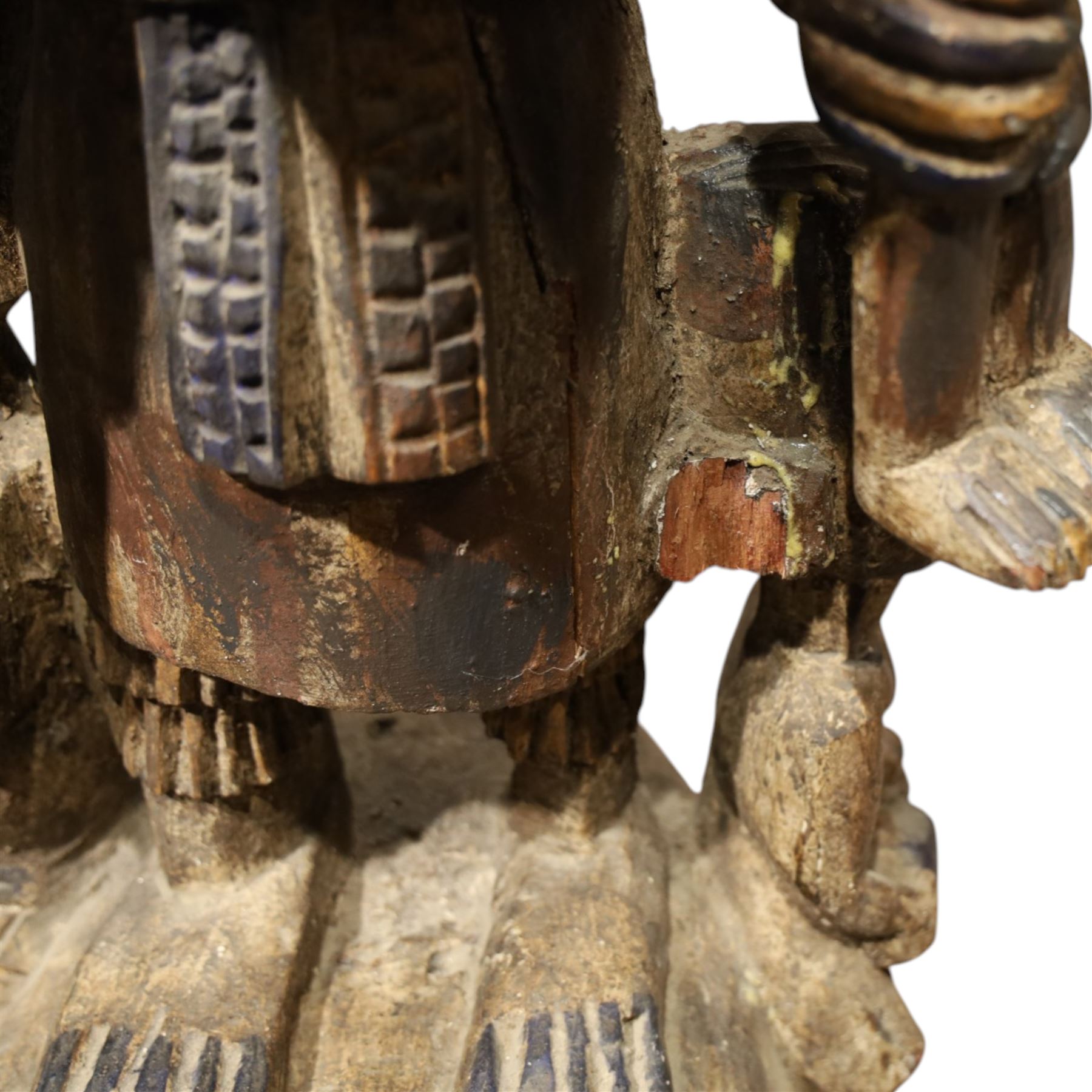 African tribal maternity figure of a woman with children, probably Yoruba, carved wood, the woman stood upon a craved mask, H133cm