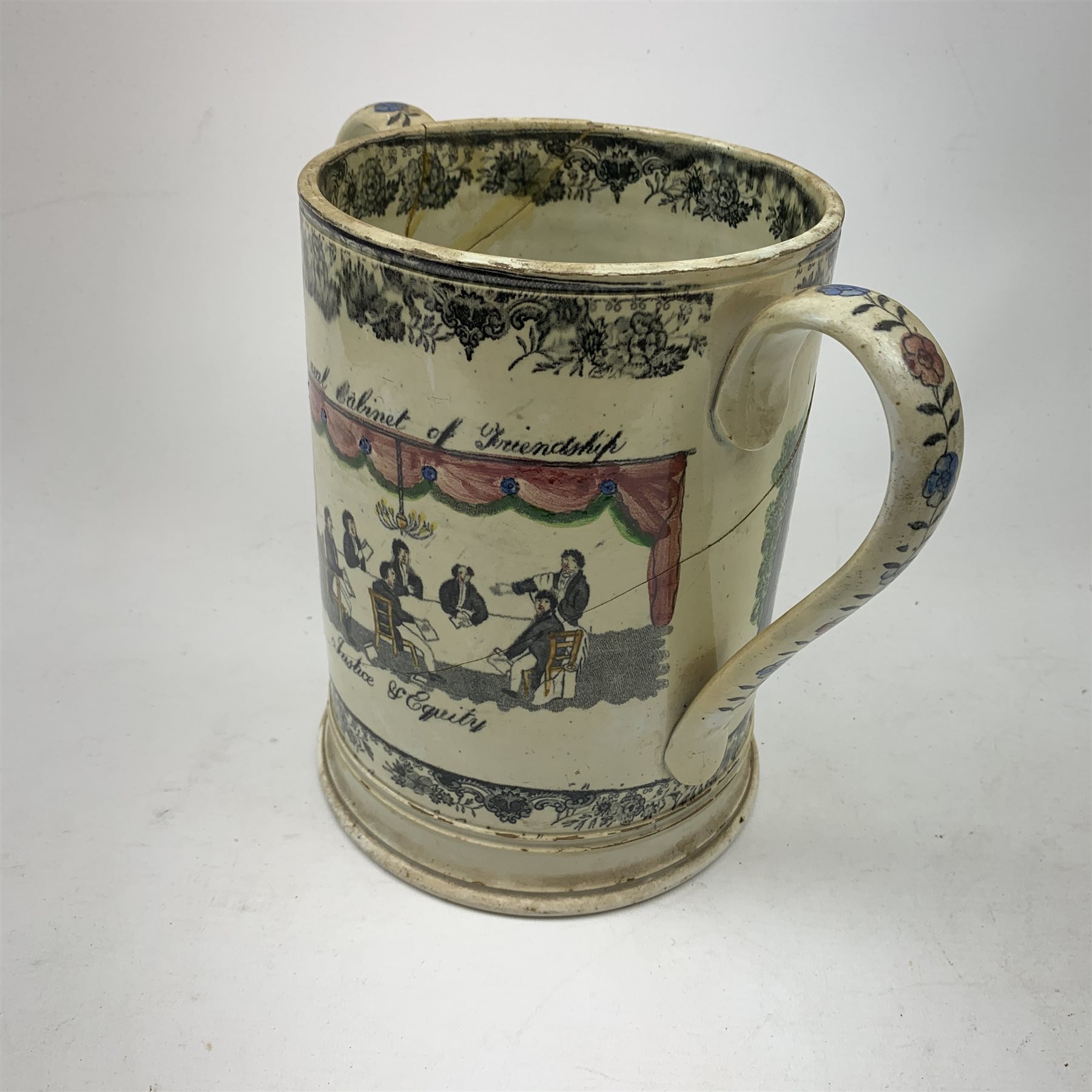 A large 19th century Staffordshire loving cup, detailed 'The Real Cabinet of Friendship Justice and Equity' (a/f), H22cm, together with a pair of 19th century Staffordshire dalmatians, upon oval blue bases, H13cm, a Dresden ewer hand painted with floral sprays, with mark beneath, H15.5cm, and a Coalbrookdale style floral encrusted vase and cover, H16.5cm. 