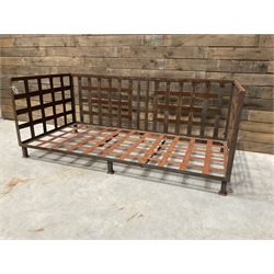Wrought iron strapwork garden day bed, lattice back and sides