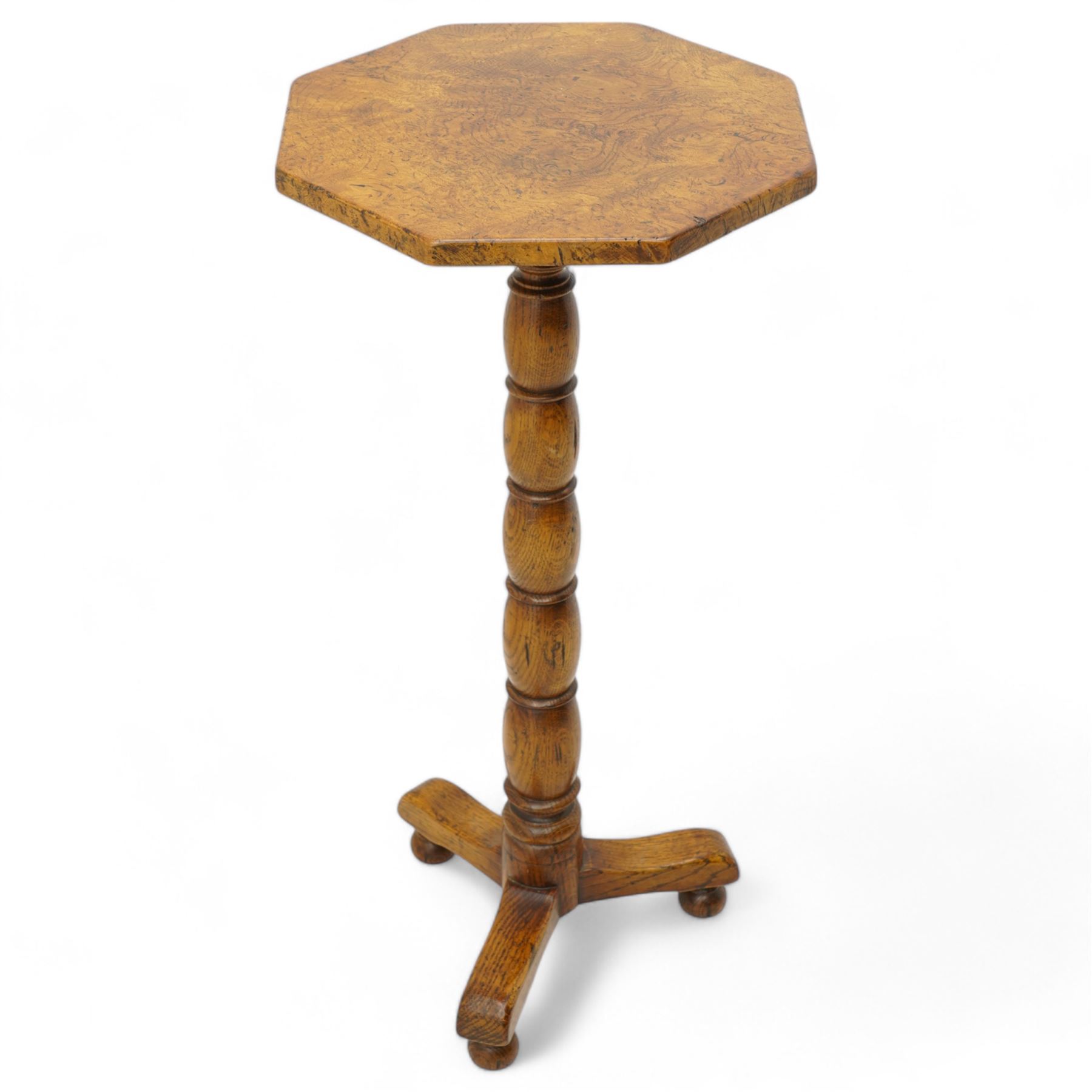 Figured and burr oak side table, octagonal top on turned column, out splayed supports on turned feet 