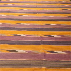 South West Persian Qashqai flatweave kilim, field decorated with bold horizontal bands in shades of aubergine, plum and orange, ochre, olive and lilac, interspersed with narrow registers of diagonal chevron motifs in cream and dark brown, framed by brown end panels, with fringe ends 