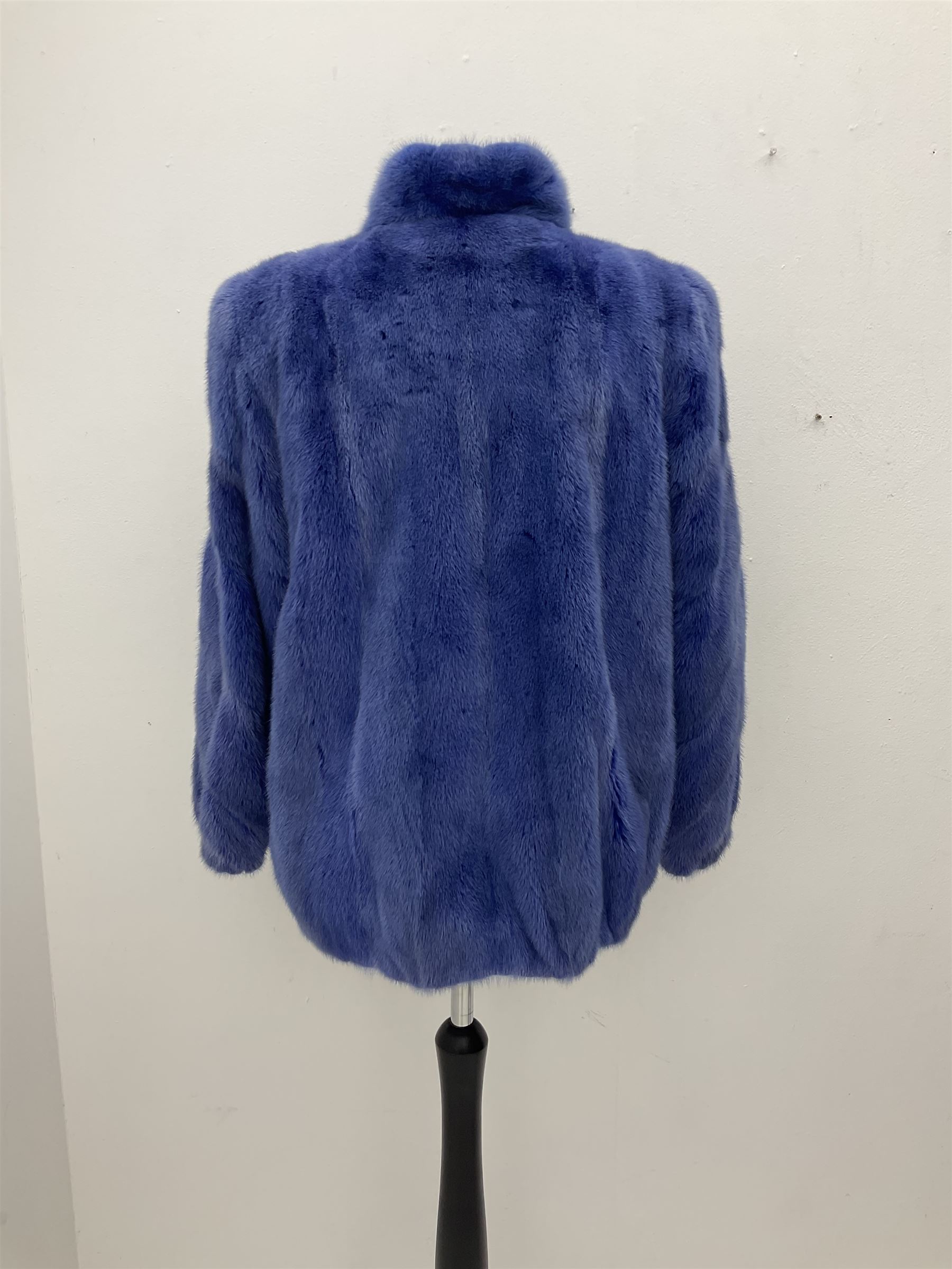Modern cut lightweight skins lavender blue mink jacket, approx size 10 to 14, with elasticated cuffs, stand up small collar, black satin style lining, zip fastener, perfect condition as new, top class mink.
