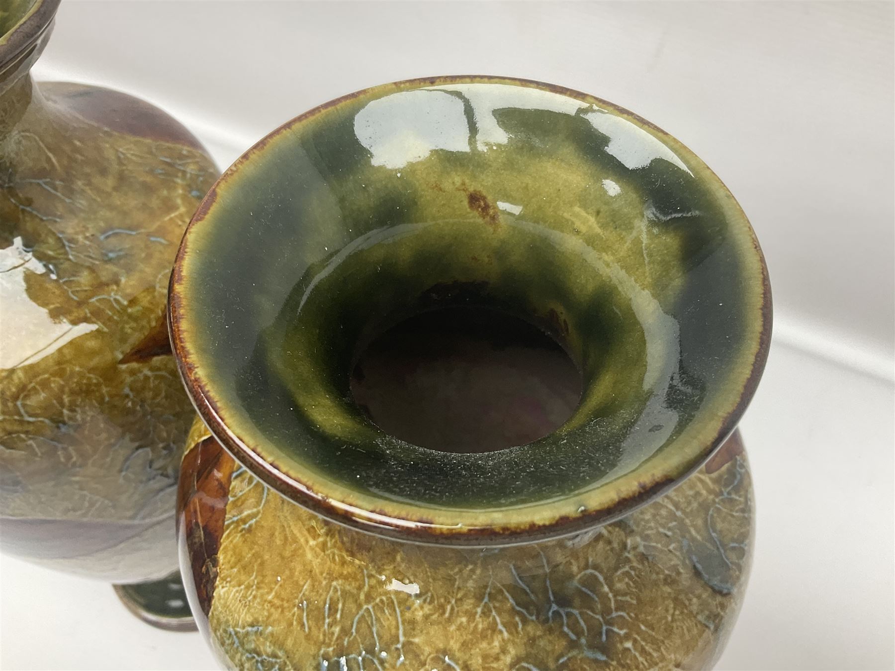 Pair of Royal Doulton Stoneware Vases with leaf decoration, by Ethel Beard, impressed marks to base numbered 6768 and 8222 and initials EB, H32cm