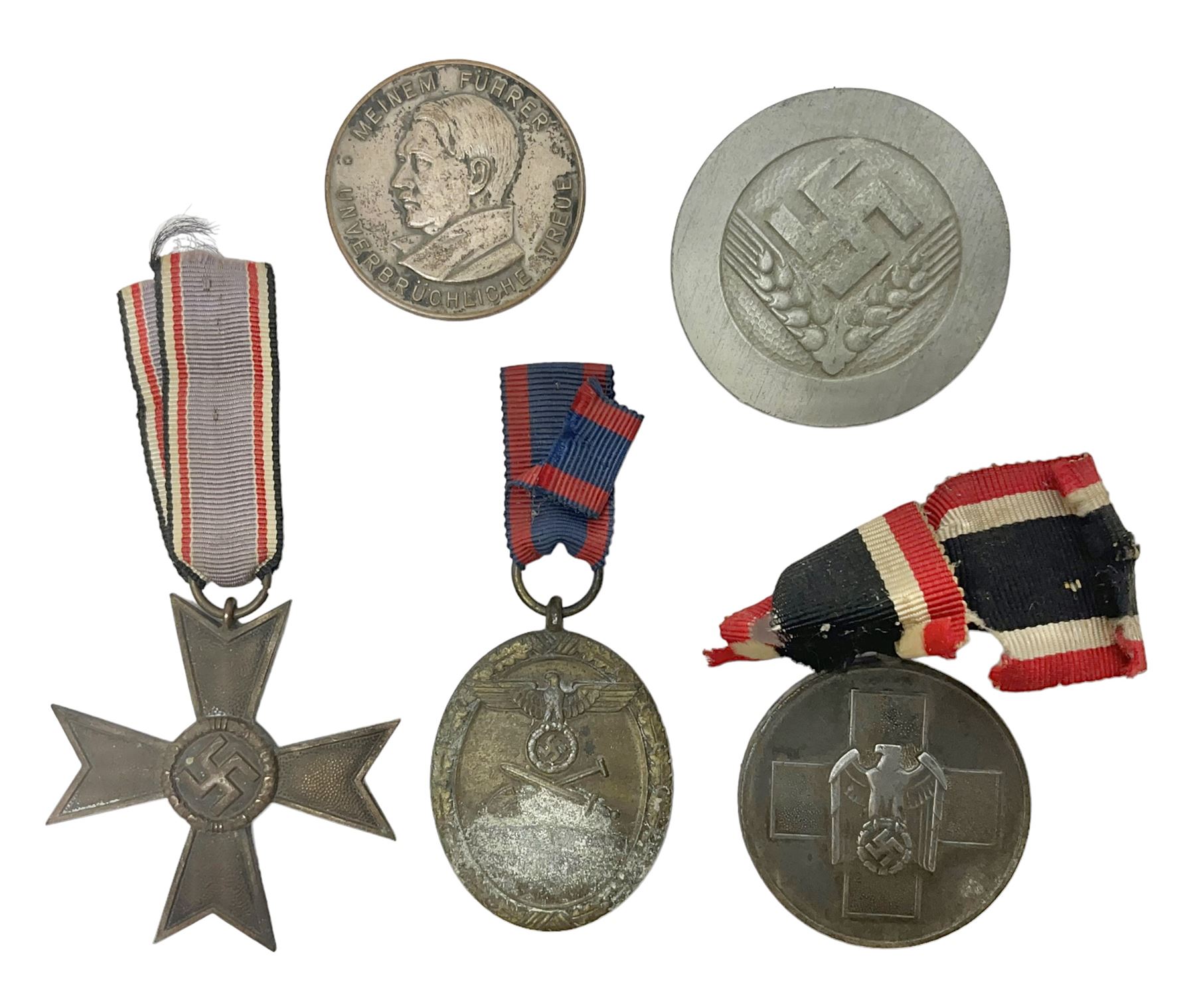 Five WW2 German medals/badges -German Defences West Wall Medal, War merit Cross, Red Cross Decoration, RAD tinnie brooch and Adolf Hitler 1934 medallion (5)