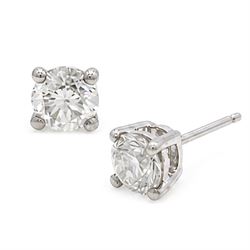 Pair of platinum diamond earrings, each stud set with a single round brilliant cut diamond, stamped PT 950total diamond weight approx 1.05 carat