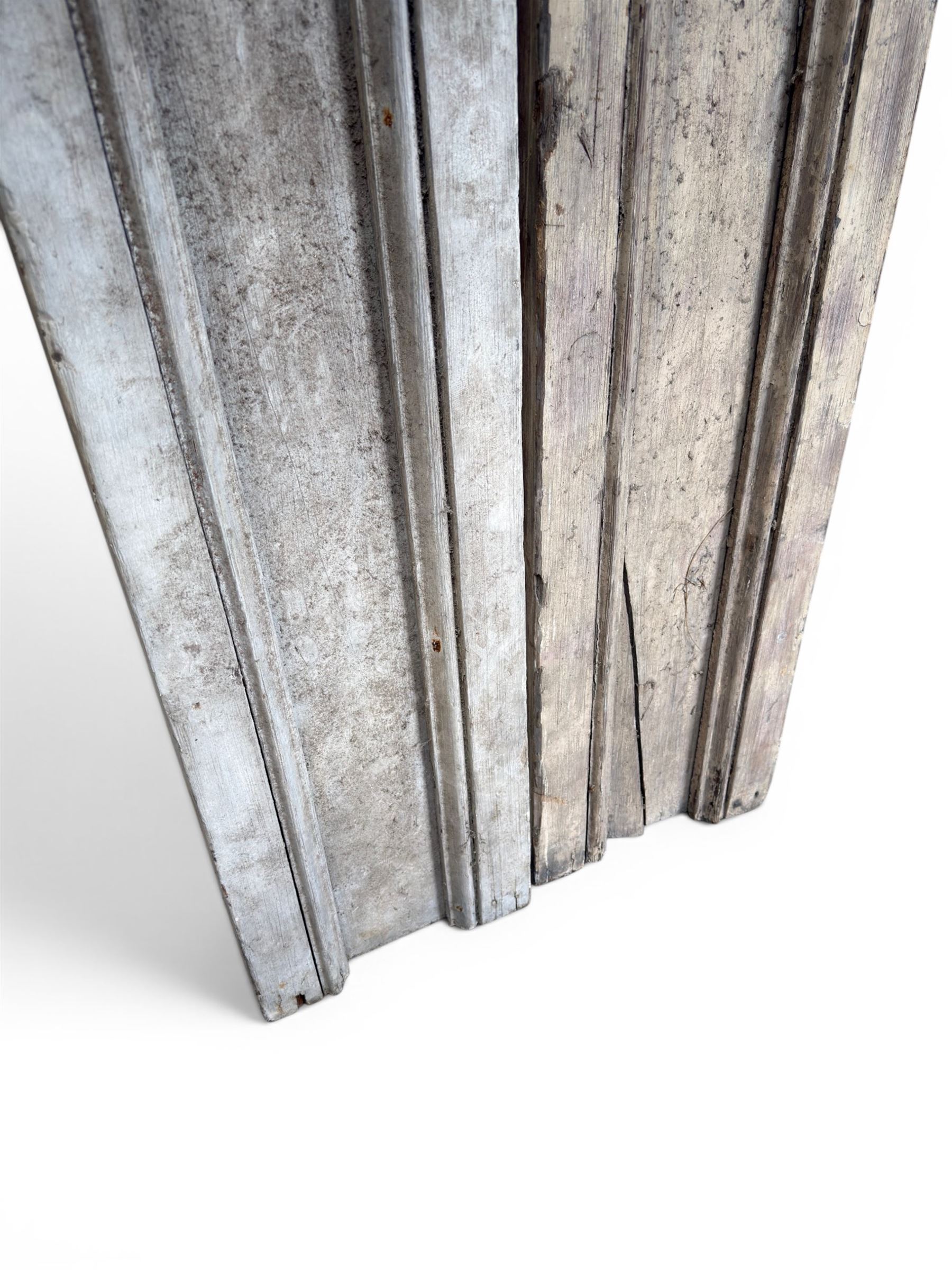 Pair of 19th century pine architectural pilasters, with painted terracotta capitols, with acanthus and scroll detail (18cm x 15cm x 57cm)