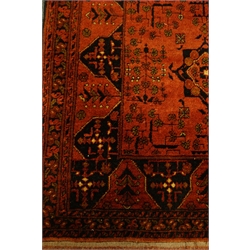  Afghan red ground rug decorated with Heretti and stylized motifs, 190cm x 133cm  