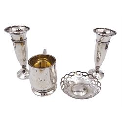 Group of silver, comprising christening mug, pair of silver trumpet shaped vases with weighted bases, and a pierced silver dish, all hallmarked, vases H13.5cm