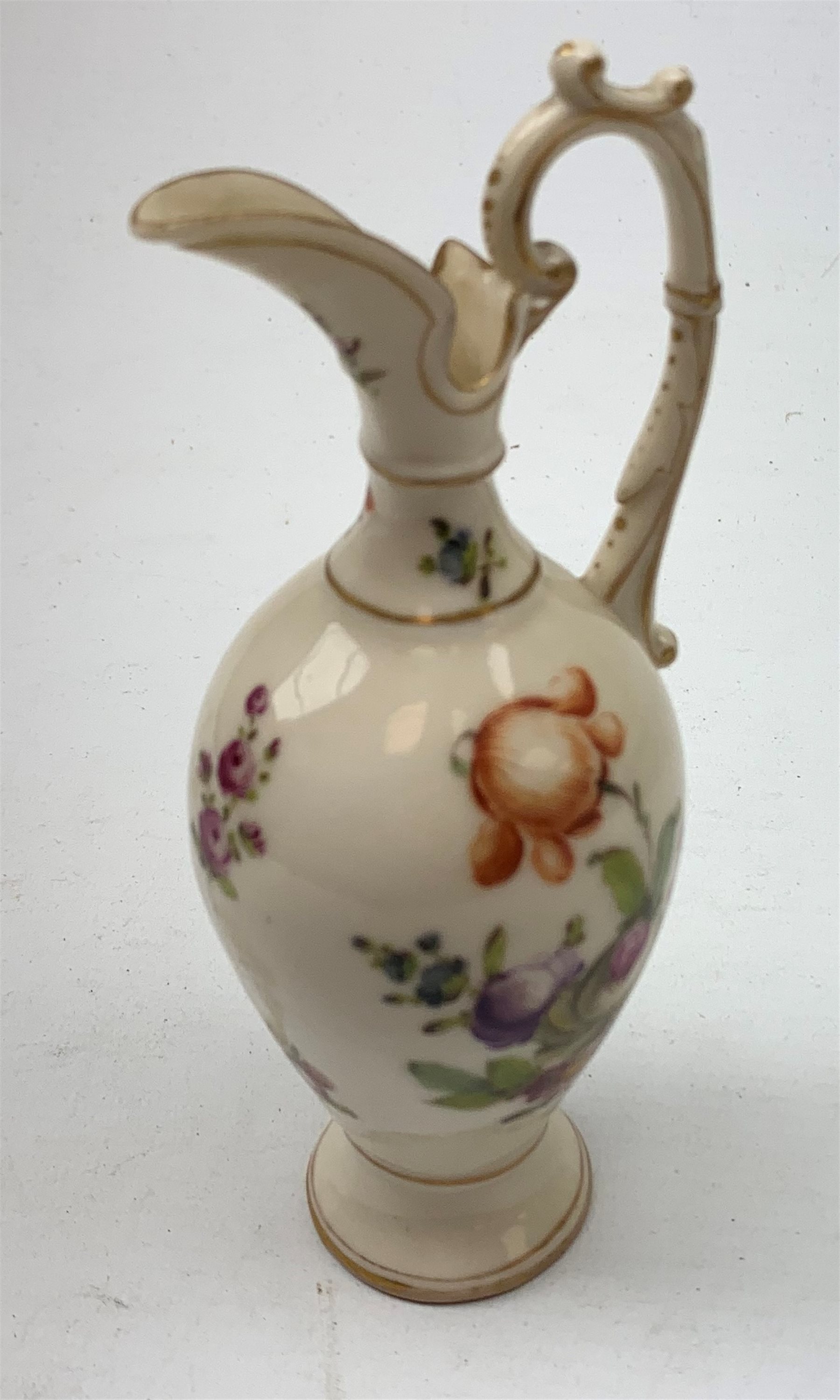 A large 19th century Staffordshire loving cup, detailed 'The Real Cabinet of Friendship Justice and Equity' (a/f), H22cm, together with a pair of 19th century Staffordshire dalmatians, upon oval blue bases, H13cm, a Dresden ewer hand painted with floral sprays, with mark beneath, H15.5cm, and a Coalbrookdale style floral encrusted vase and cover, H16.5cm. 
