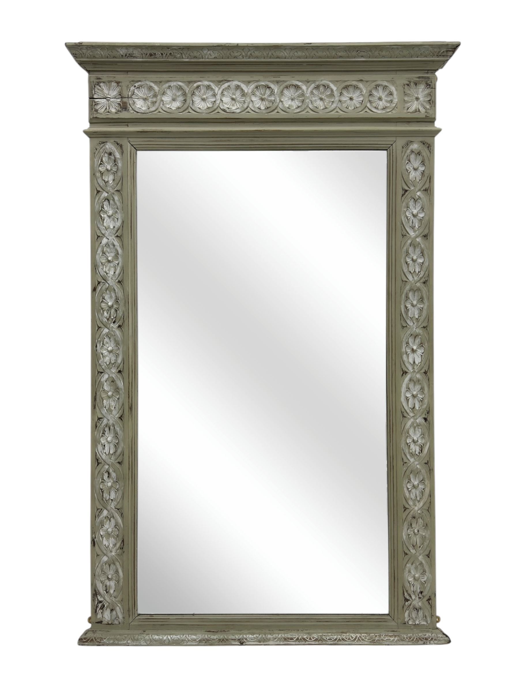 Victorian green and white painted mirror, rectangular bevelled plate within a moulded frame carved in relief with a continuous band of flowerhead roundels, the upper section with stepped cornice and leaf carved frieze  