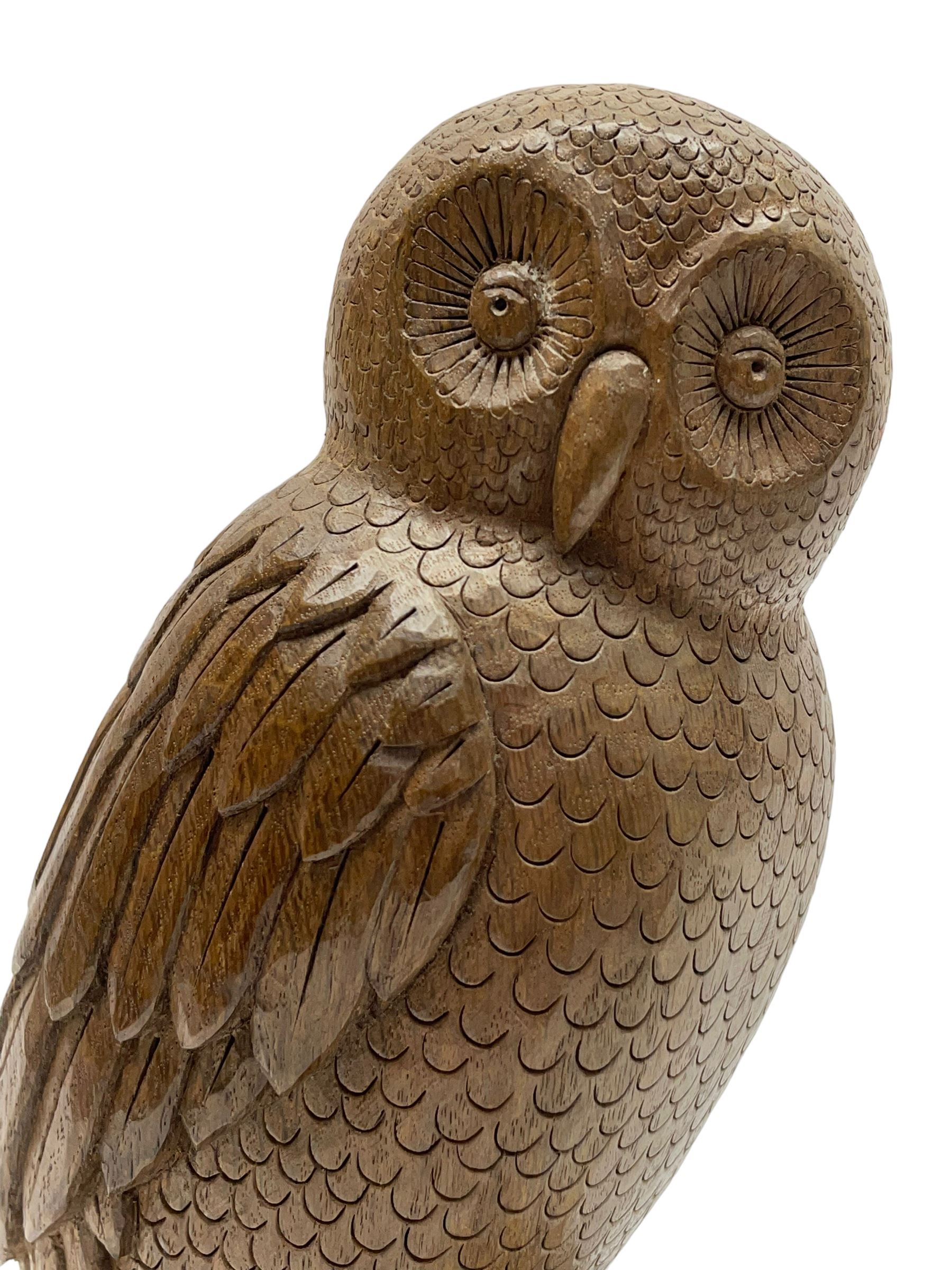 Acornman - carved oak owl perched on branch, on tooled block plinth carved with acorn signature, by the workshop of Alan Grainger, Brandsby (carved by Norman Darnley)