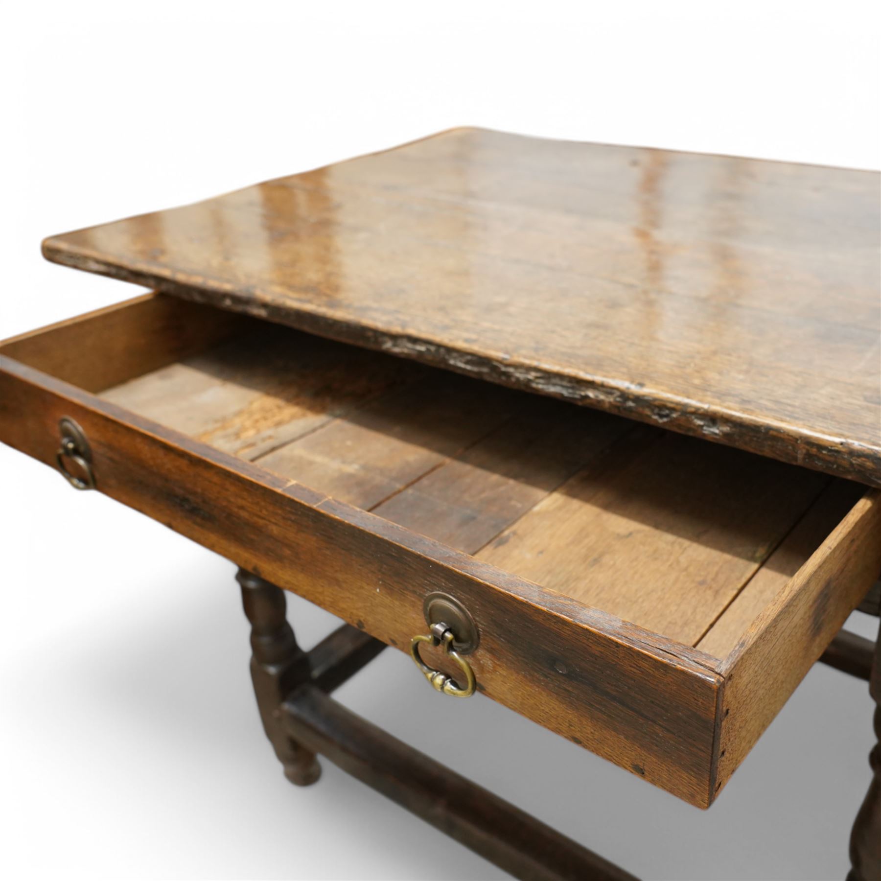 18th century oak side table, two plank rectangular top over single drawer, on turned supports united by plain stretchers 