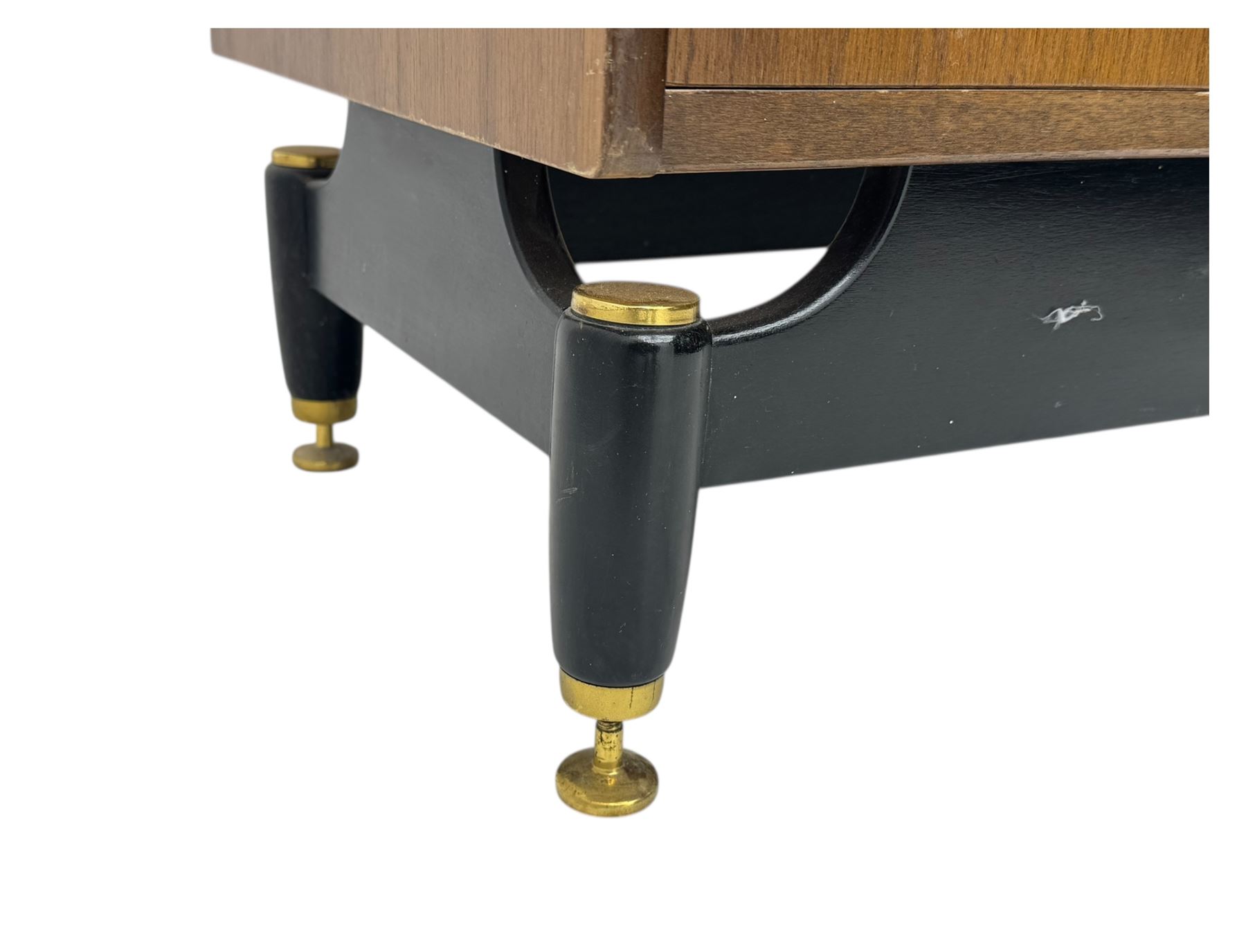 G-Plan teak tallboy, seven drawer chest with brass loop handles, ebonise base with adjustable brass terminals
