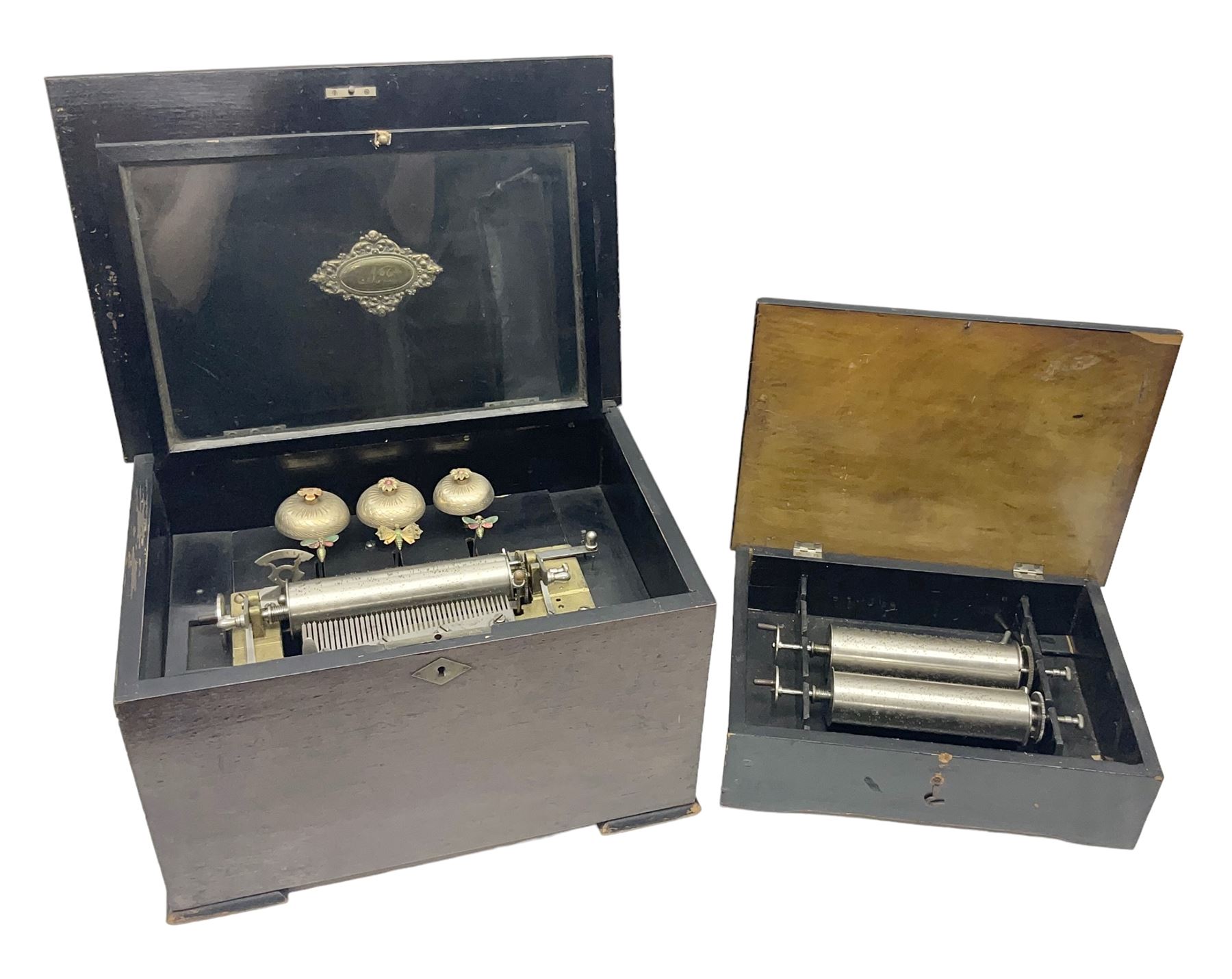 Swiss - 19th-century cylinder music box with three butterfly bells in sight, in a mahogany case with two separately boxed  6” cylinders, glazed viewing lid, 41 tooth comb (one tooth broken) crank key missing, movement untested.